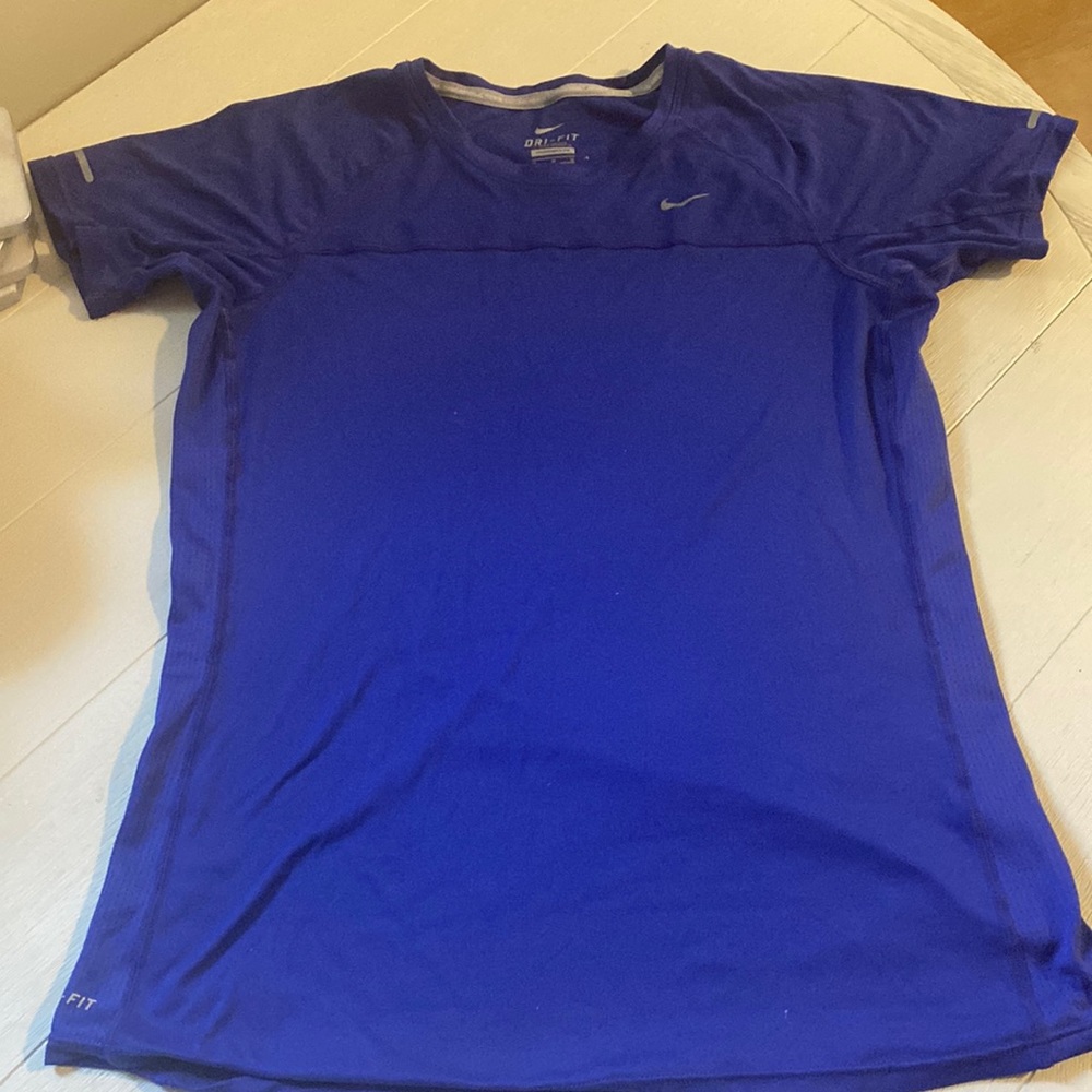Women’s Nike dri fit shirt in purple. Size medium.